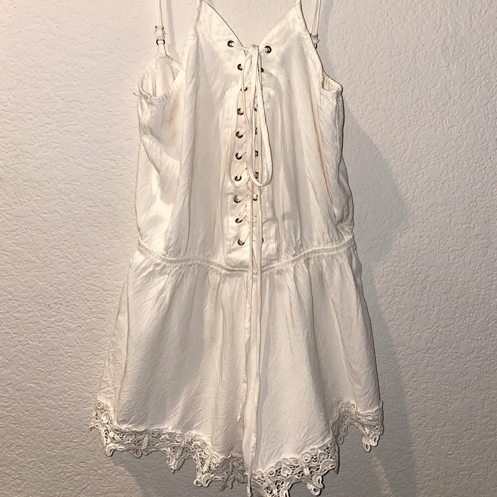 Off white, ties in the front.